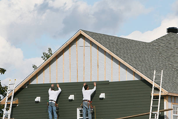 Professional Storm Damage Siding Repair technician working in Lake Grove, NY